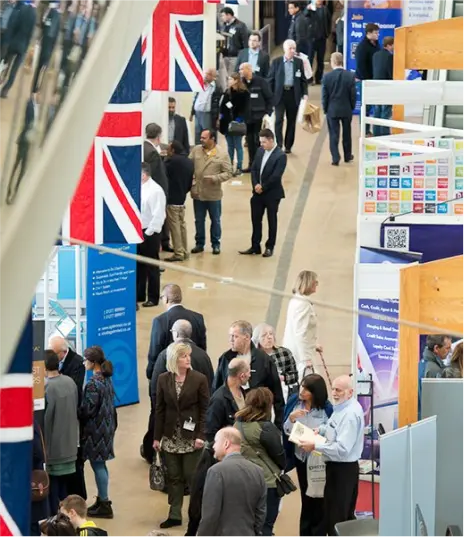 Overhead view of a crowded trade show aisle